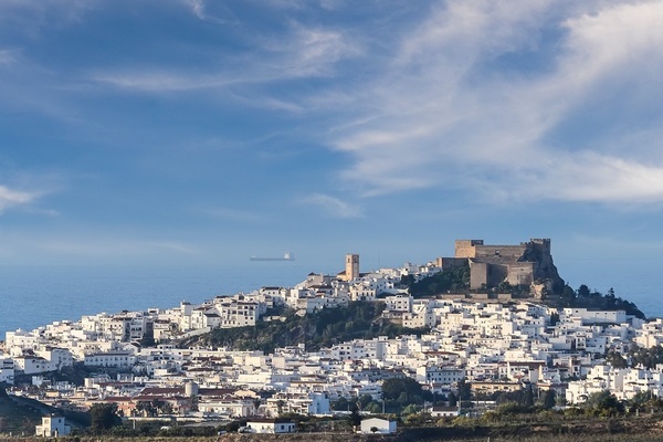 a small town with a castle on top of it