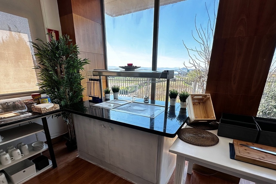 a kitchen with a counter top and a window