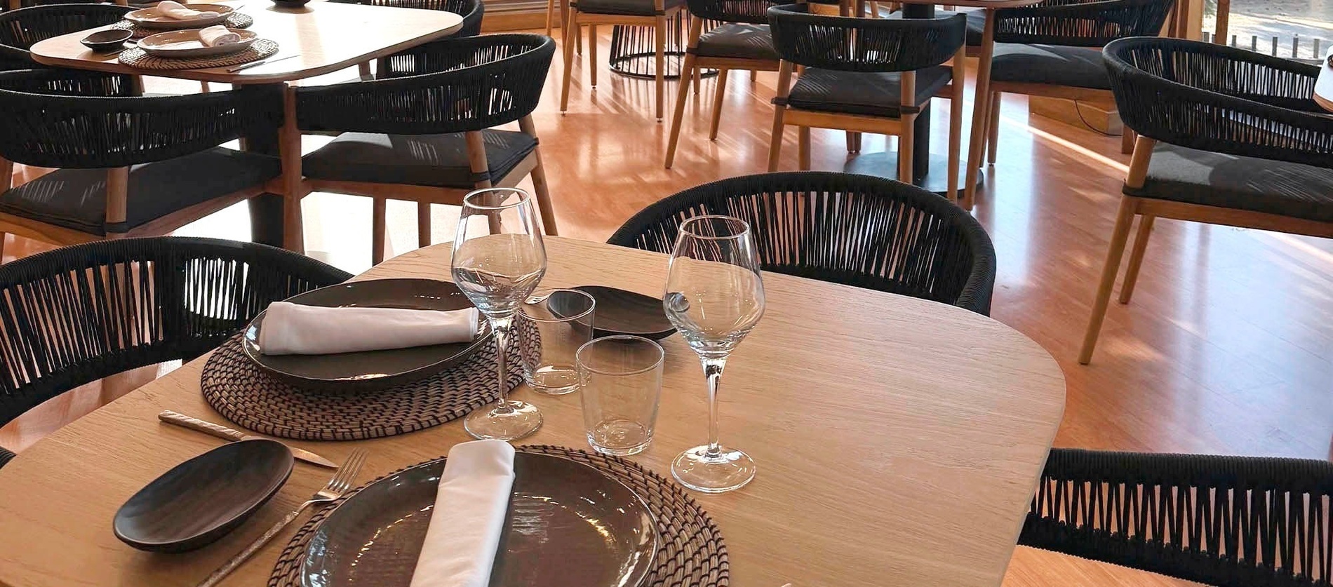 an aerial view of a city with white buildings and brown roofs