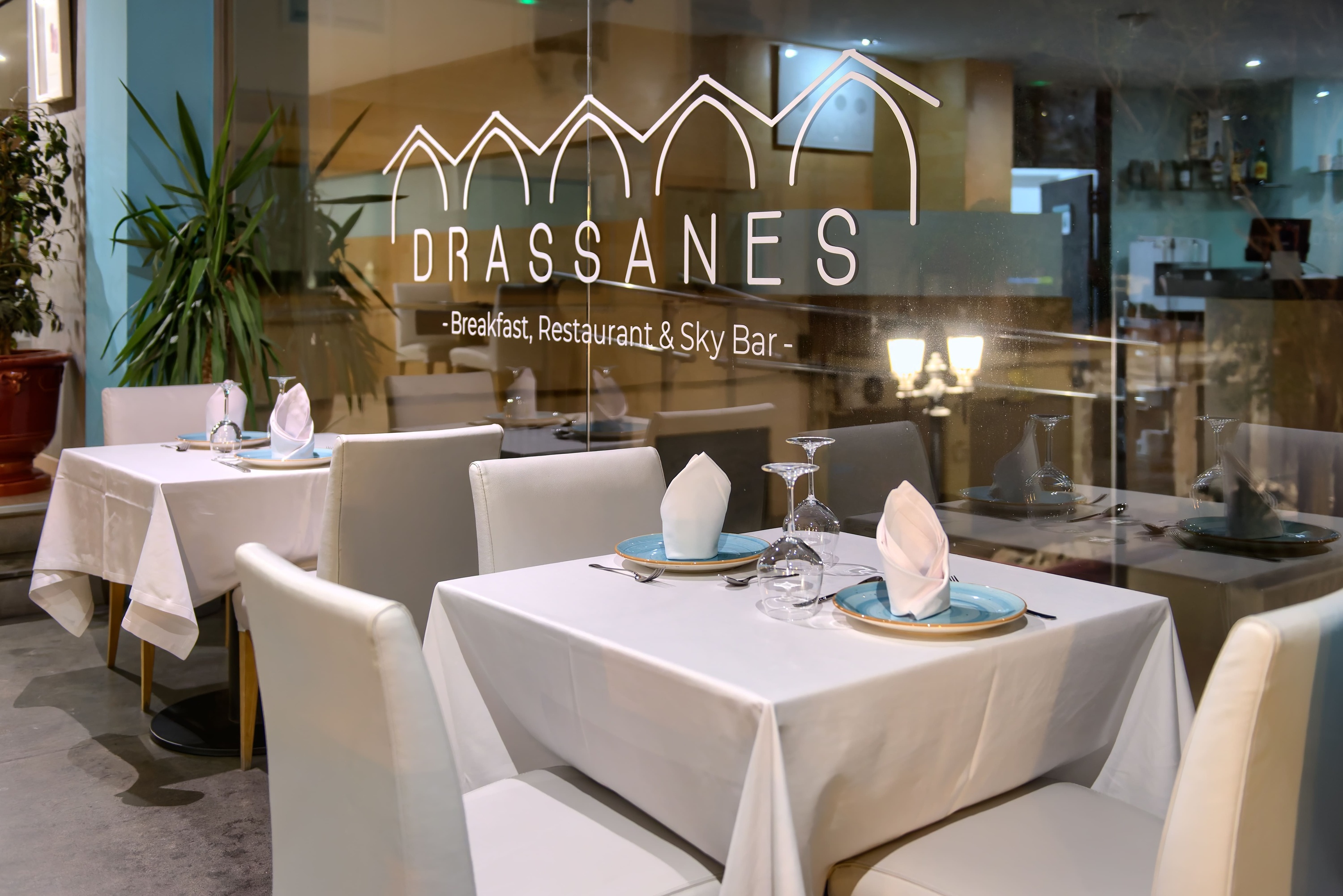 a restaurant called drassanes has tables and chairs set up