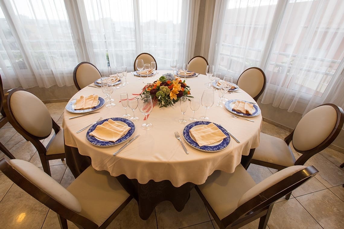 a round table with plates and glasses on it