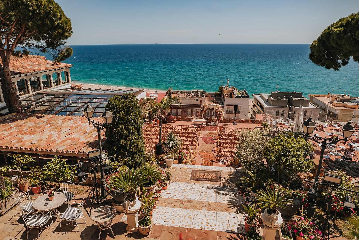 Roger De Flor by Seleqtta terrace: sea views, wedding setup, outdoor seating.