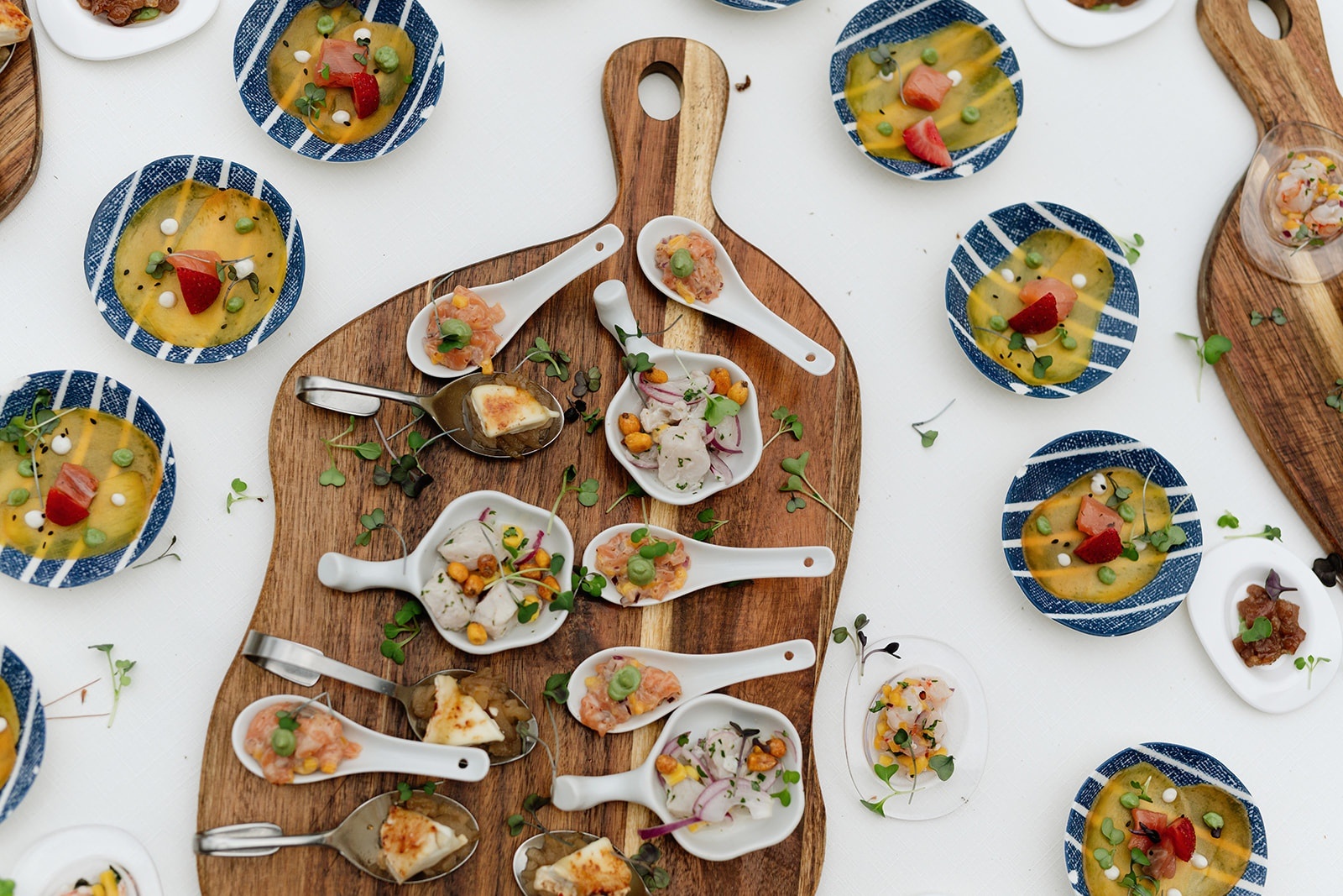 Elegant appetizers at Roger De Flor By Seleqtta: ceviche, tartare, and carpaccio.