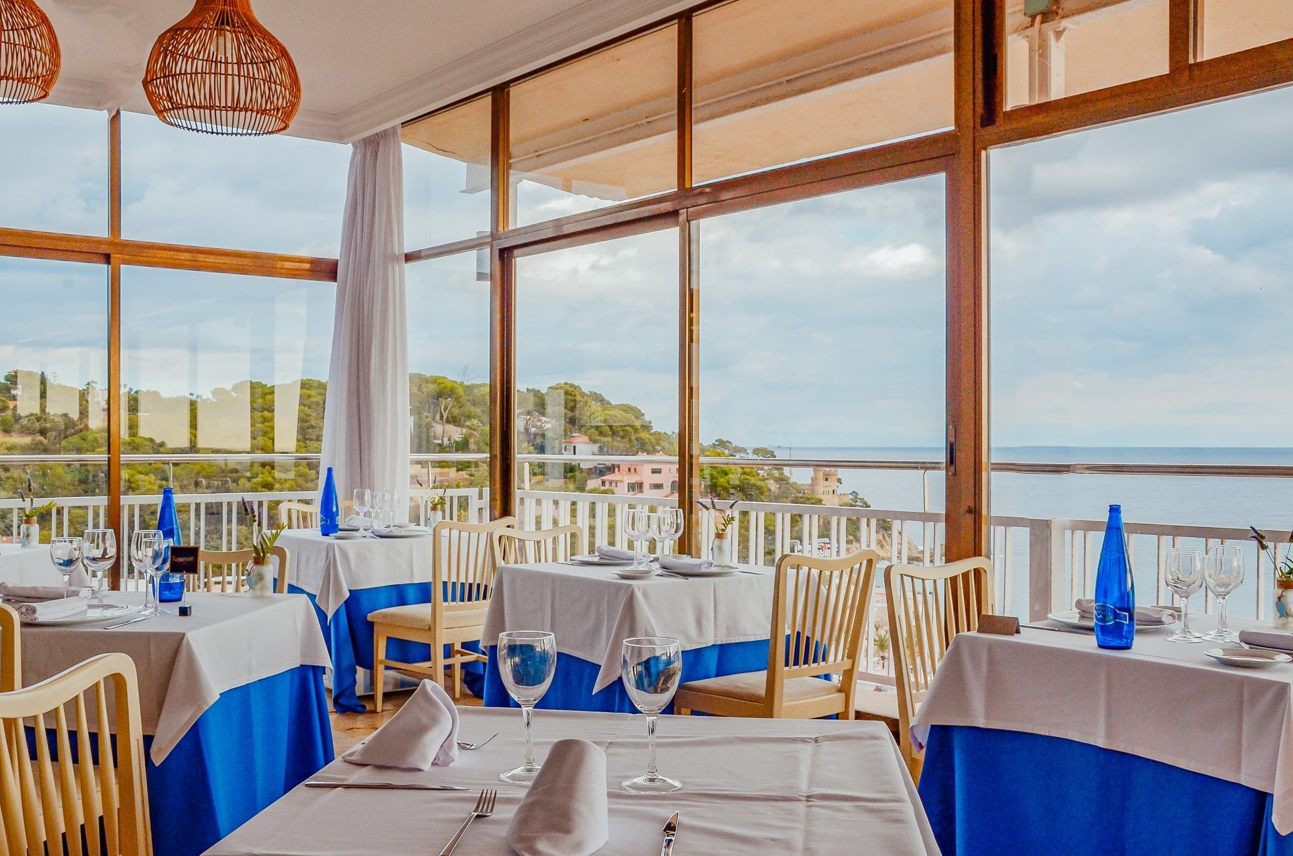 a restaurant with tables and chairs and a sign that says ' a ' on it