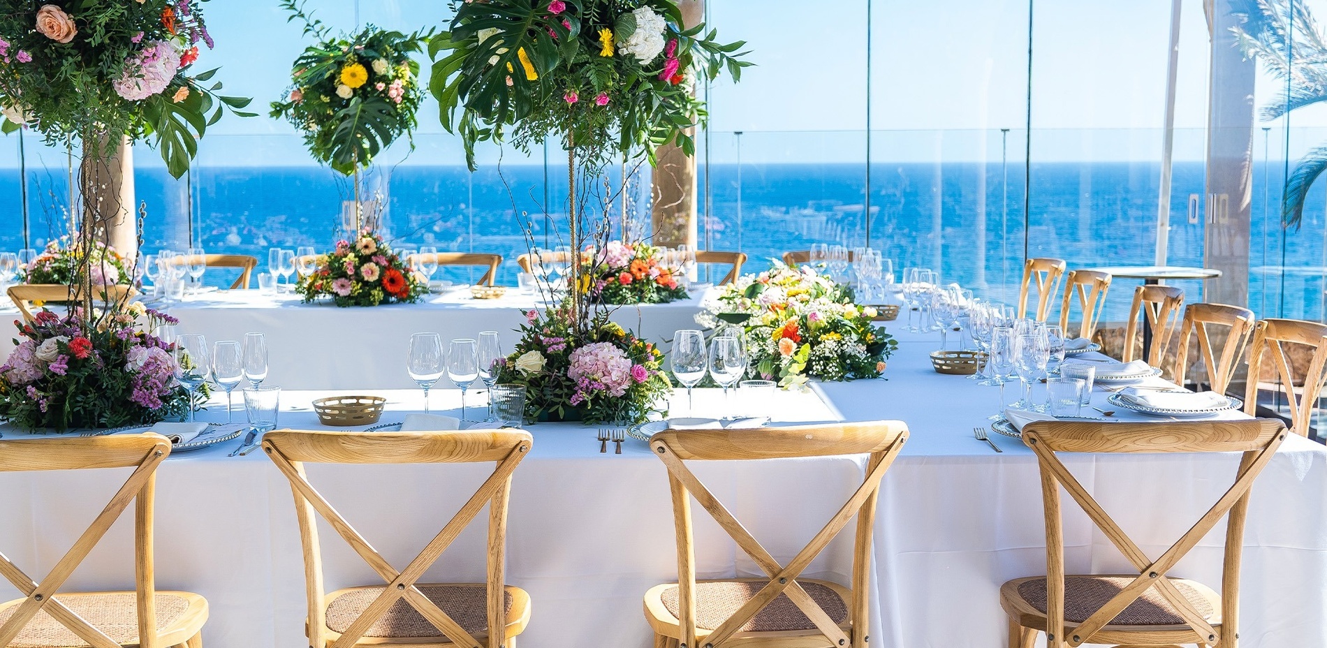 a table with a lot of wine glasses on it