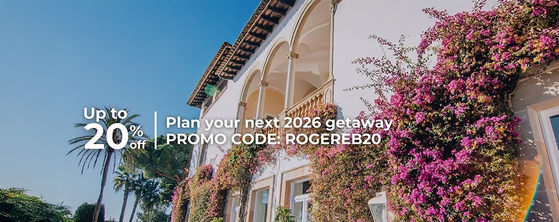 an aerial view of a large swimming pool surrounded by chairs and tables
