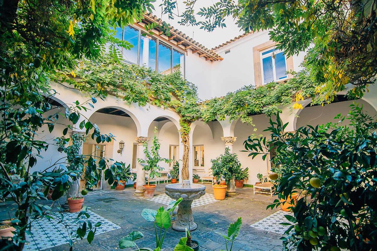 Charming Roger De Flor By Seleqtta courtyard with fountain and lush greenery