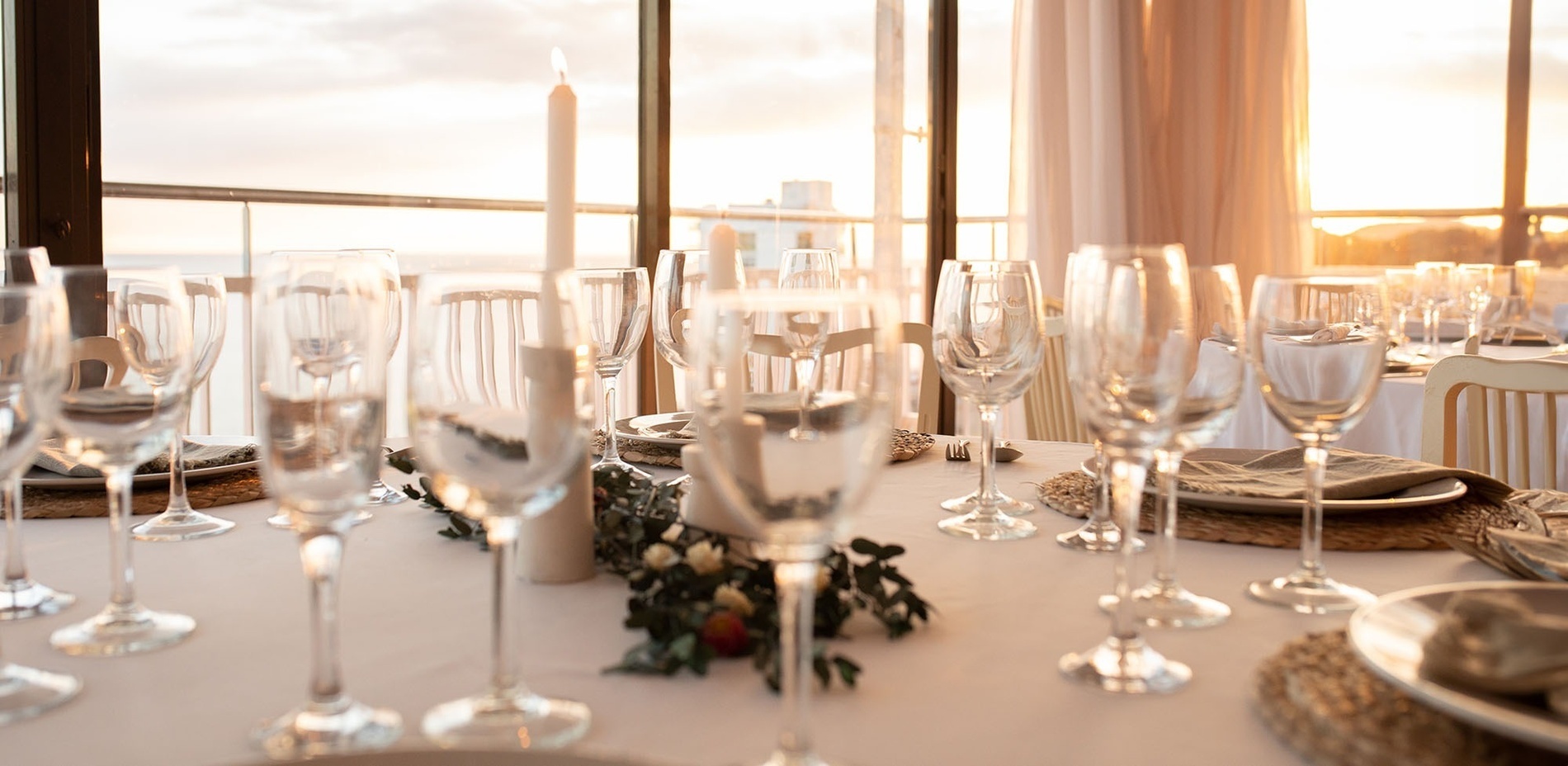 a table with a lot of wine glasses on it