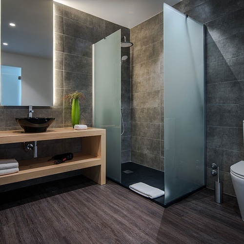 a bathroom with a toilet a sink and a mirror