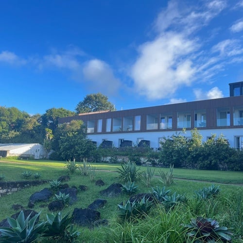 a large building with a lot of windows and stairs