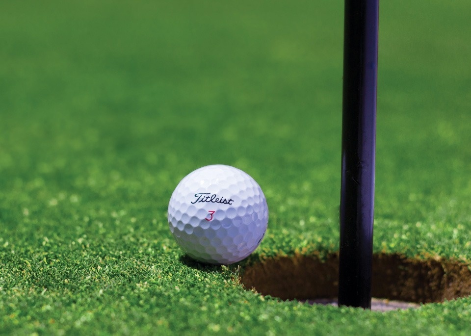 a golf ball with the number 3 on it