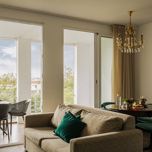 a living room with a couch a chair and a flat screen tv