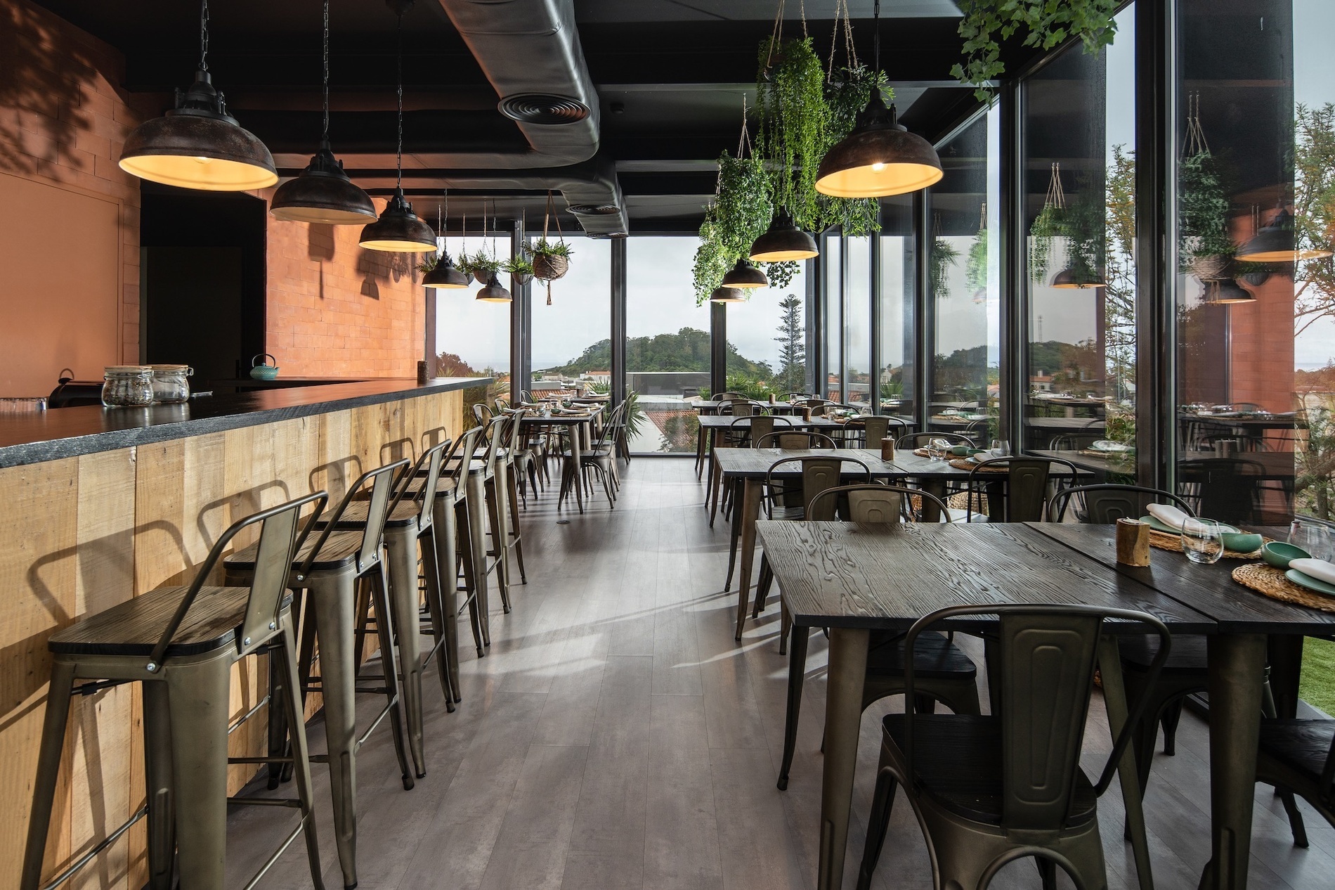 a restaurant with tables and chairs and a large window