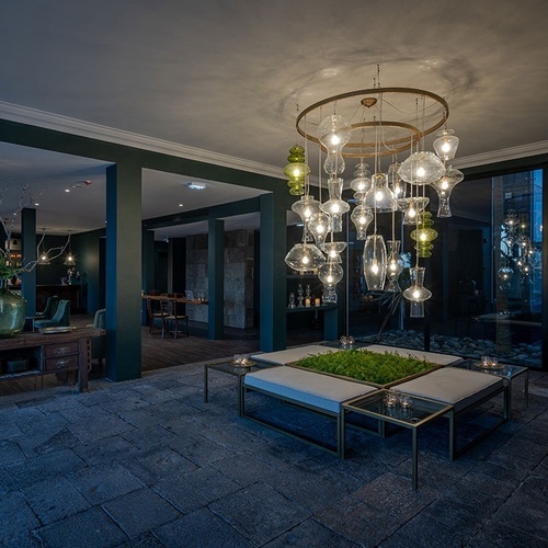 a room with a lot of lights hanging from the ceiling