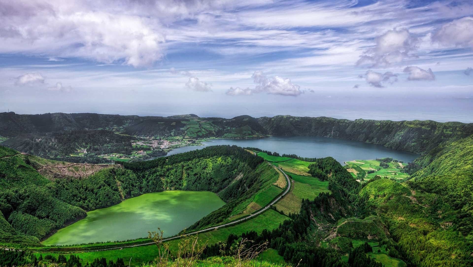 a view of a lake surrounded by mountains and trees