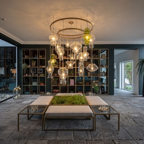 a room with a lot of lights hanging from the ceiling