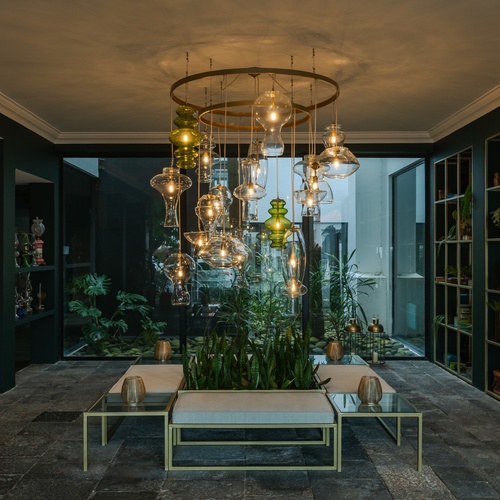 a room with a lot of lights hanging from the ceiling