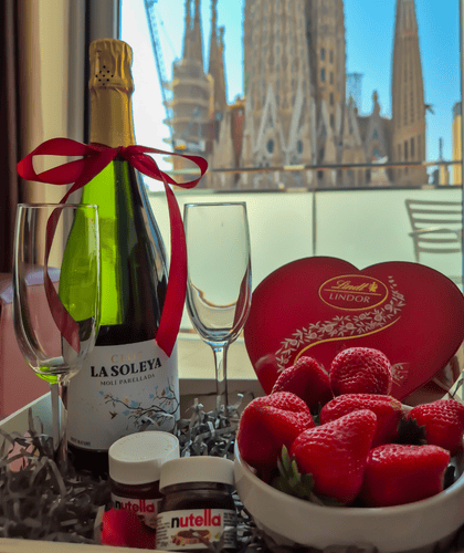 a glass filled with red and purple chocolate hearts