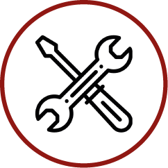 a wrench and screwdriver are crossed in a red circle .