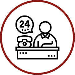 a line drawing of a man sitting at a desk talking on a phone .