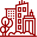 un icono rojo de una ciudad con muchos edificios y árboles .
