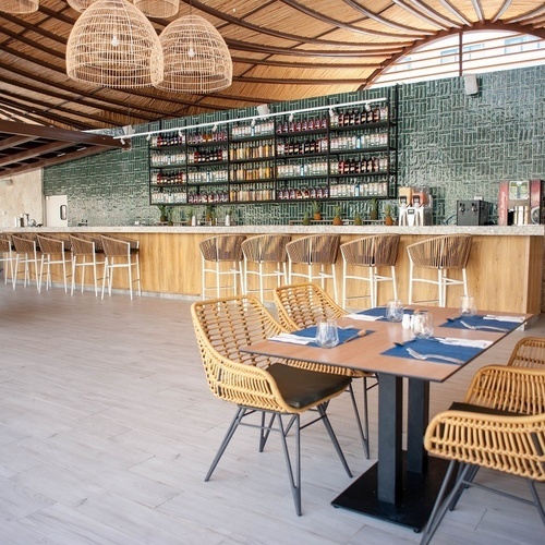 a restaurant with tables and chairs and a bar