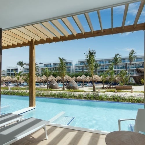 a view of a swimming pool from a hotel room