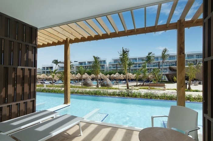 a view of a swimming pool from a hotel room