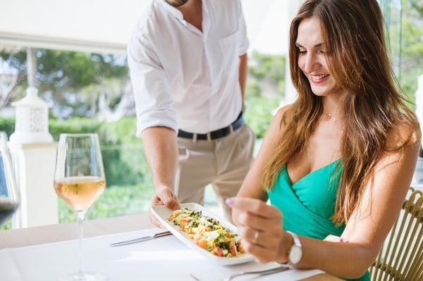 a restaurant with blue chairs and white tables