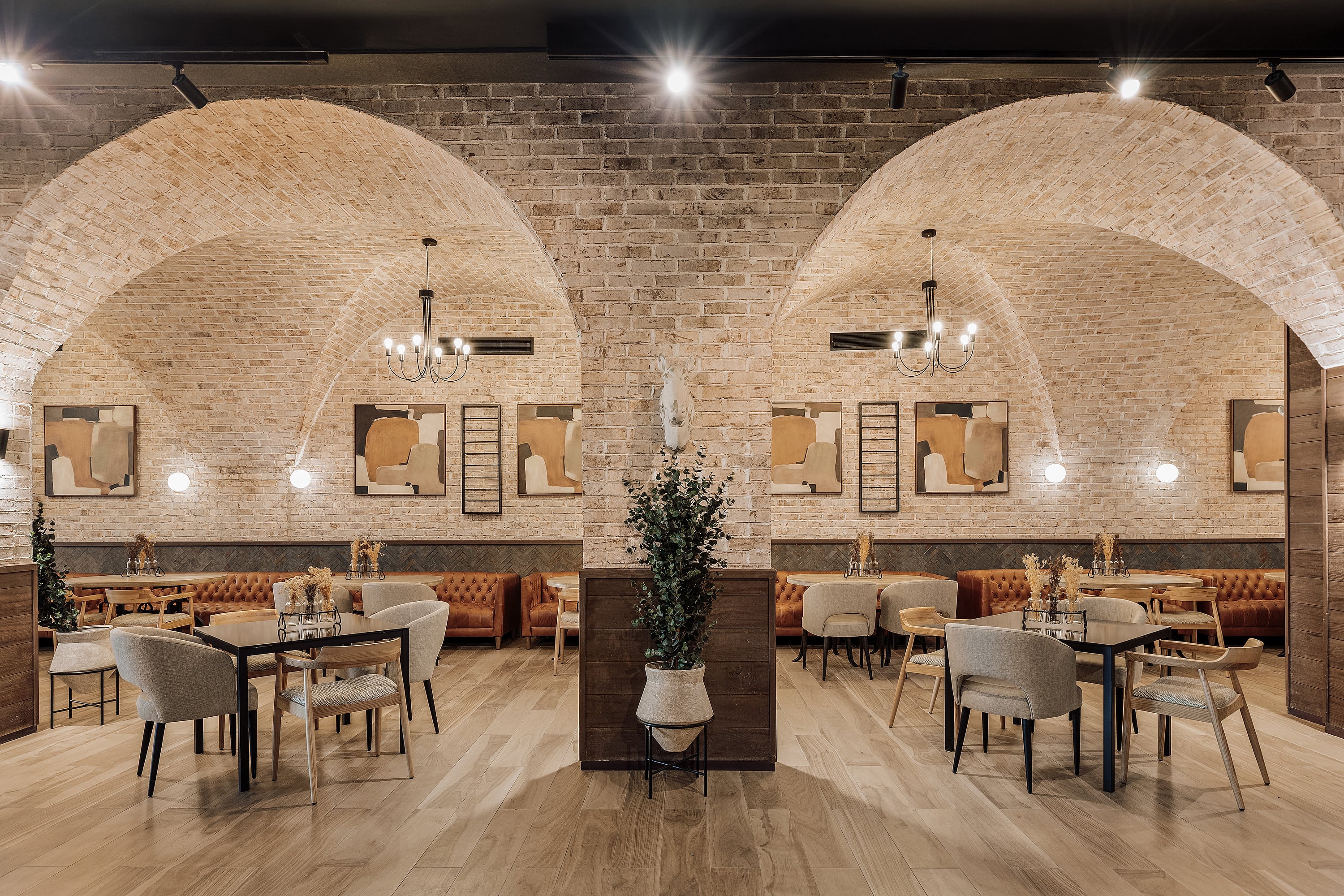 Rustic interior design at Serenade Caribe Club featuring vaulted ceilings and horse decor.