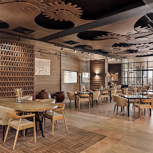 Stylish dining room with rustic charm and industrial ceiling accents Serenade Caribe Club