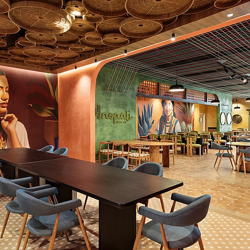Vibrant Mexican restaurant with unique ceiling decor, artwork, and comfortable seating, perfect for Serenade Caribe Club.