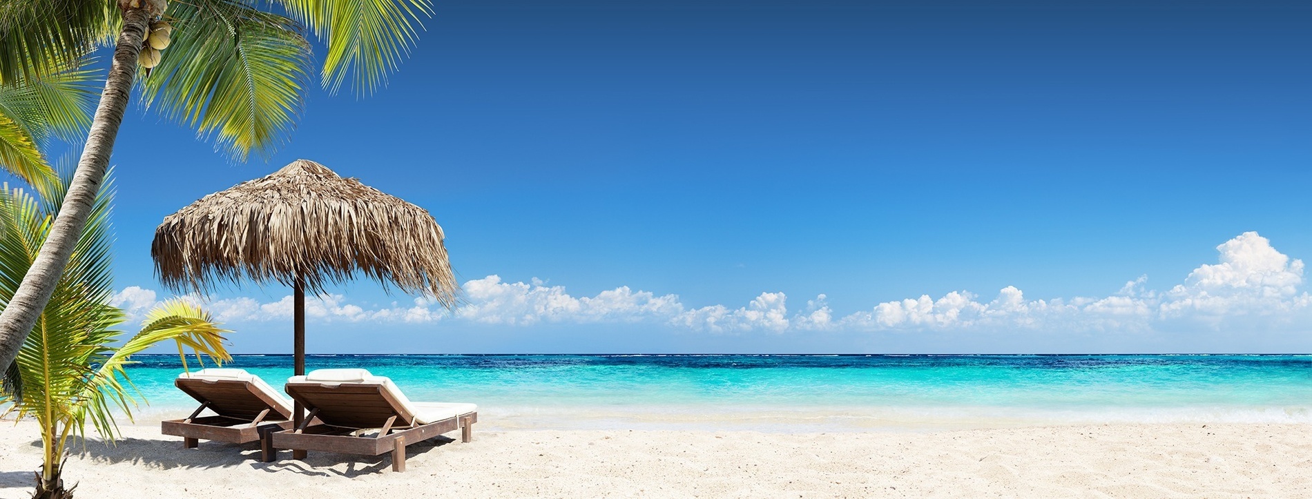 a man and a woman are sitting in a swimming pool