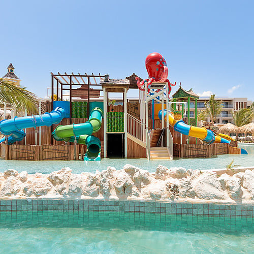 Waterpark at resort, with slides and a red octopus Serenade Caribe Club.