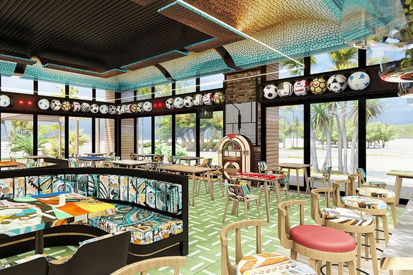 a restaurant with many tables and chairs and a jukebox