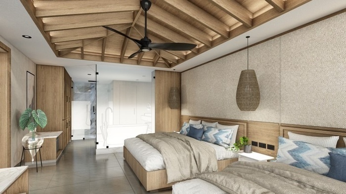 This image captures a spacious bedroom featuring two beds with blue and white accents, a distinctive slatted wooden ceiling with a black ceiling fan, textured light-colored walls, and an open concept bathroom or dressing area separated by glass.