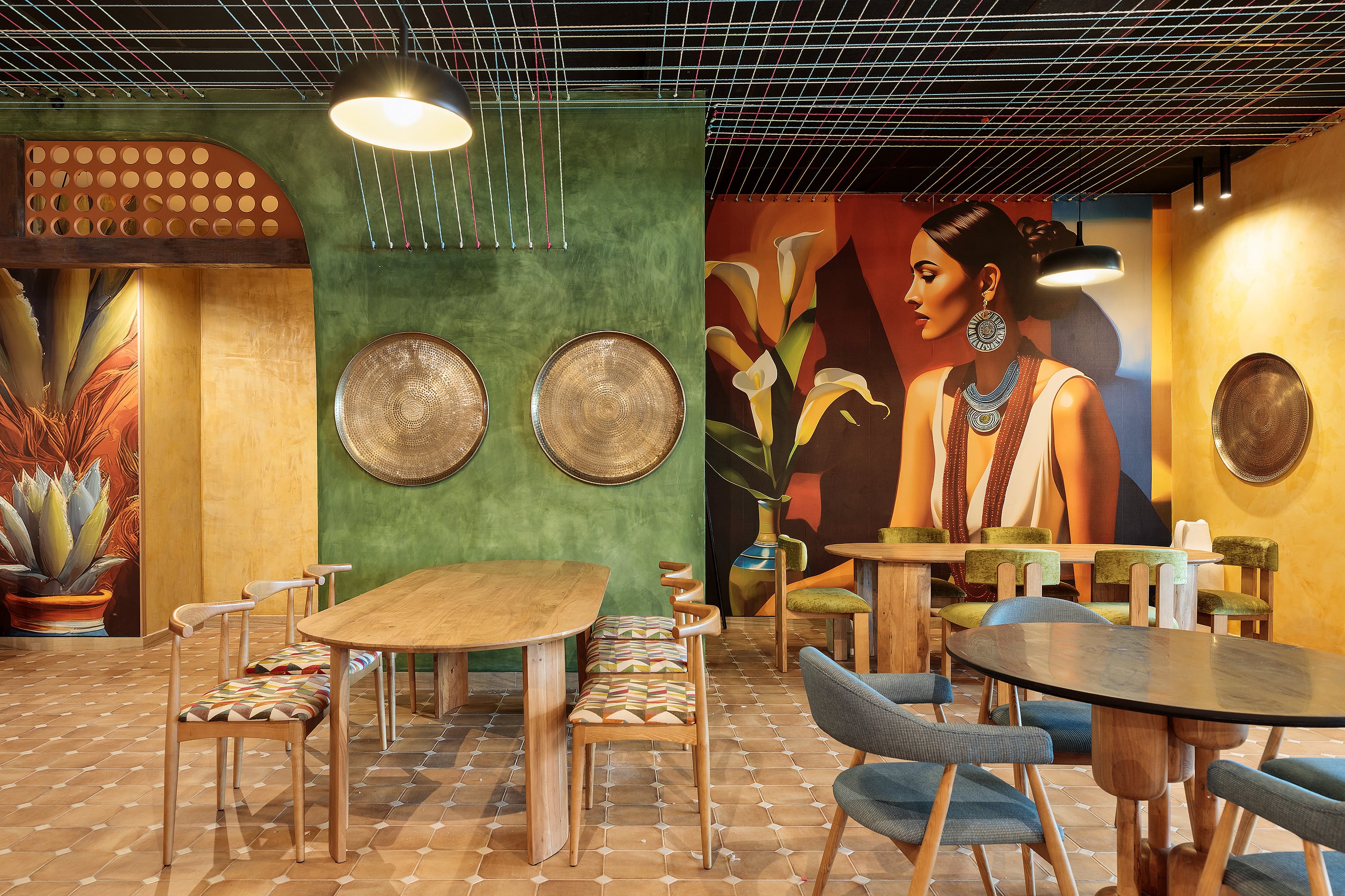 Serenade Caribe Club restaurant with turquoise chairs and yellow floor.