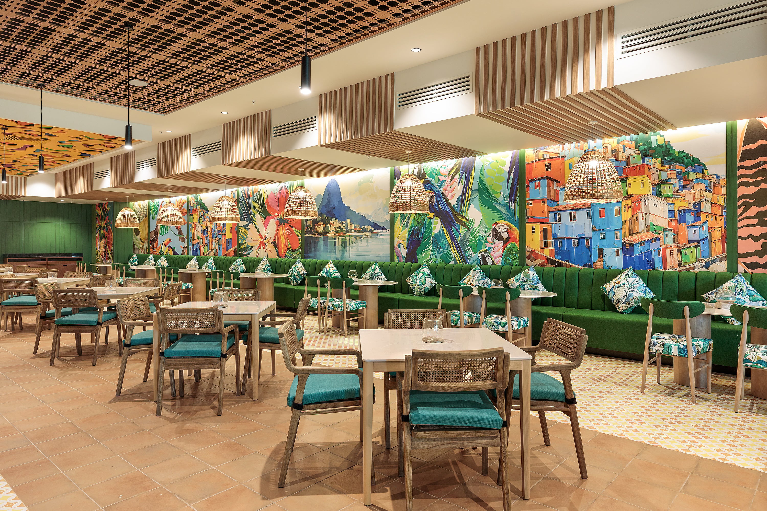 Serenade Caribe Club modern design: yellow sofa, greenery, and MOEMA sign.