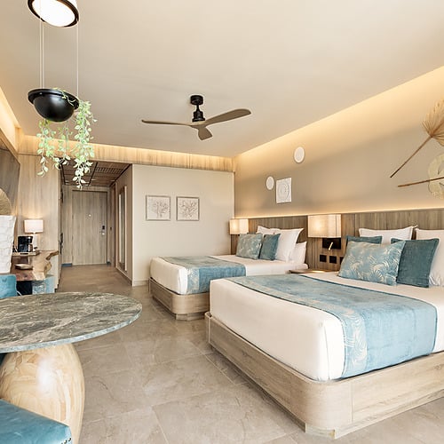 Serenade Caribe Club room: modern design with ceiling fan & balcony.