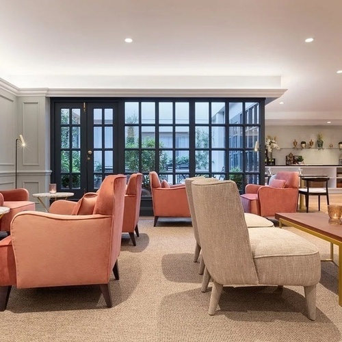 a living room filled with furniture and a flat screen tv