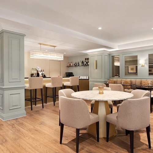 a restaurant with tables and chairs and a bar