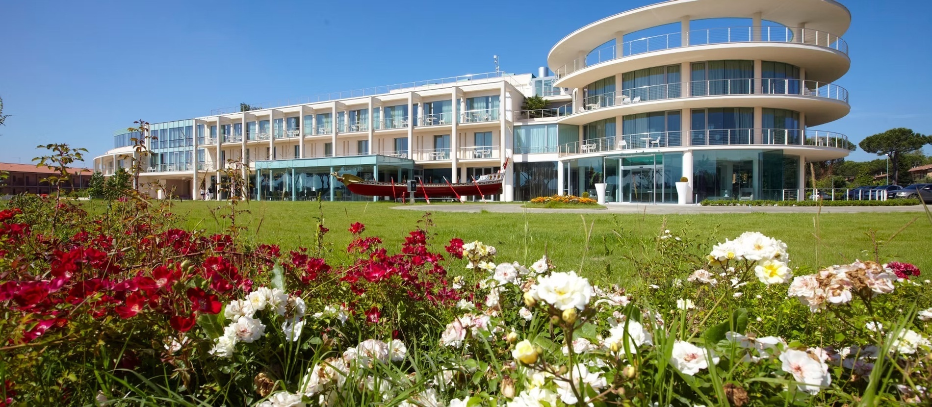 a large swimming pool surrounded by chairs and umbrellas