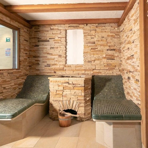 a room with a green exit sign on the wall