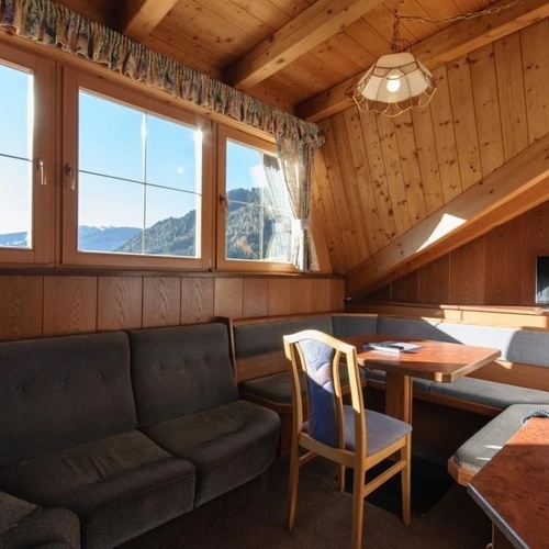 a living room with a couch a table and a television