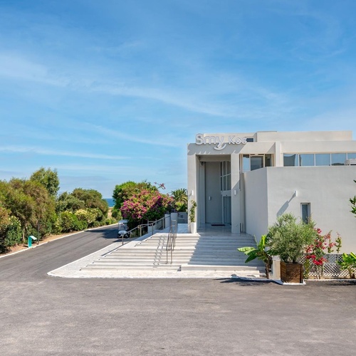 a white building with the word stay green on it