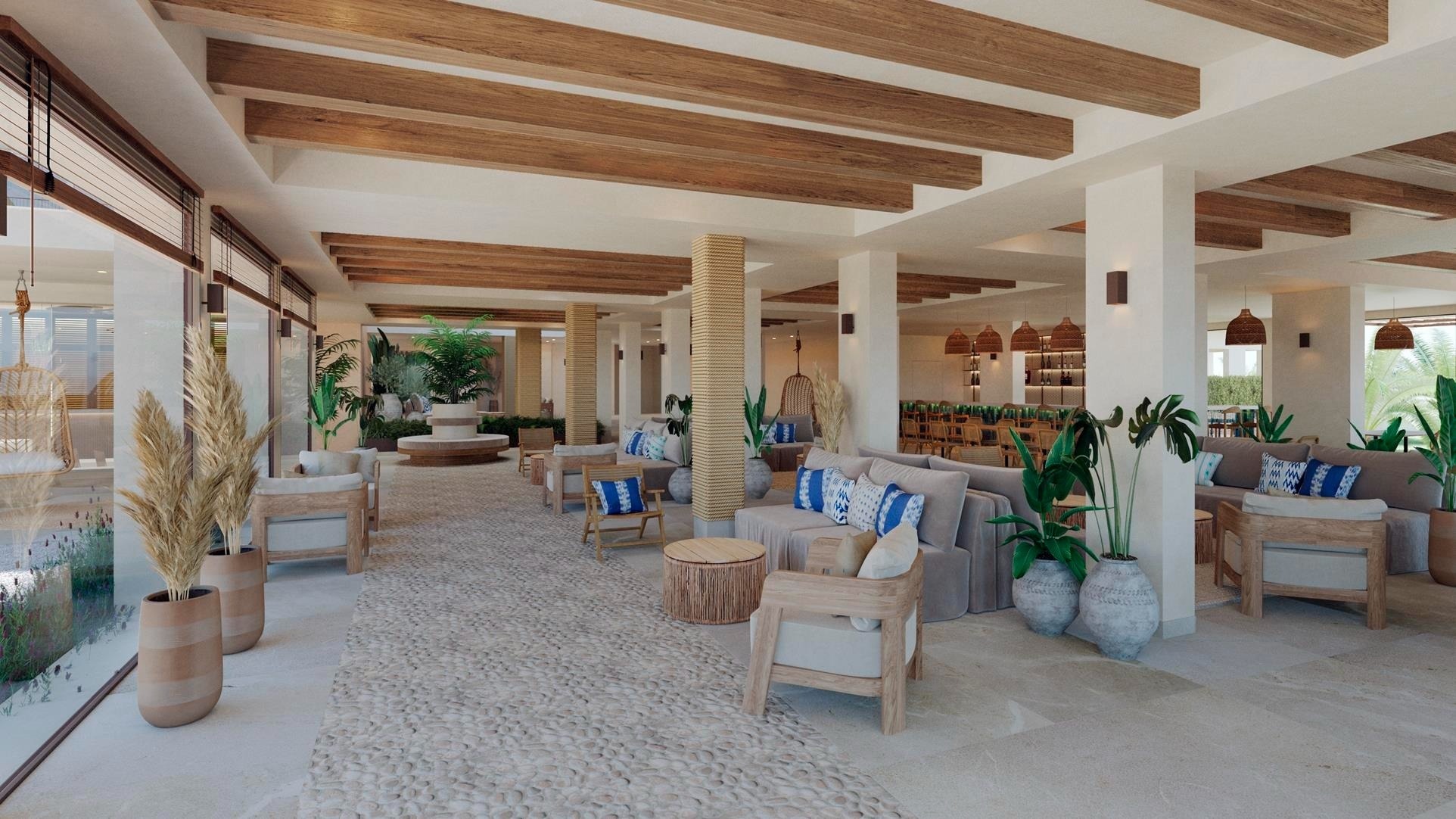 a glass of red liquid with a straw on the beach