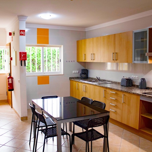 a kitchen with a fire extinguisher on the wall