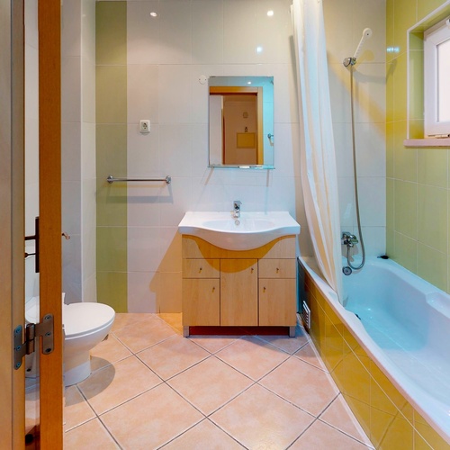 a bathroom with a sink toilet and bathtub