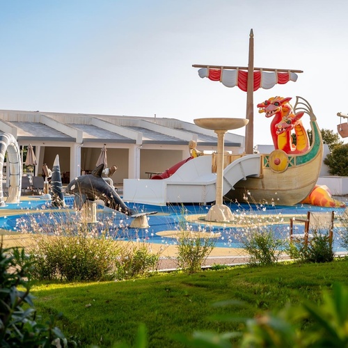 a pirate ship with a dragon on the top of it