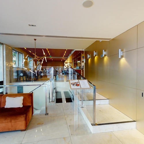 a hotel lobby with a sign that says 0 floor